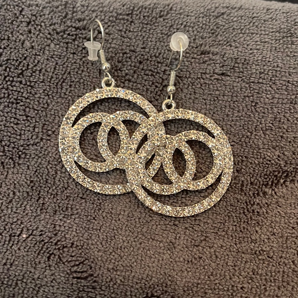 Silver and gold earring set.